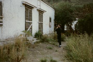 Frater Paulos standing
before the front of the abandoned Abbey of Thelema.